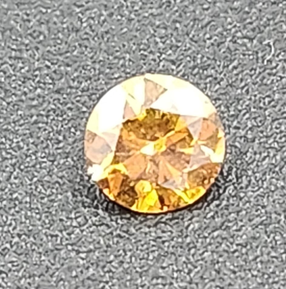 0.408 carat Vivid fancy Brownish Yellow