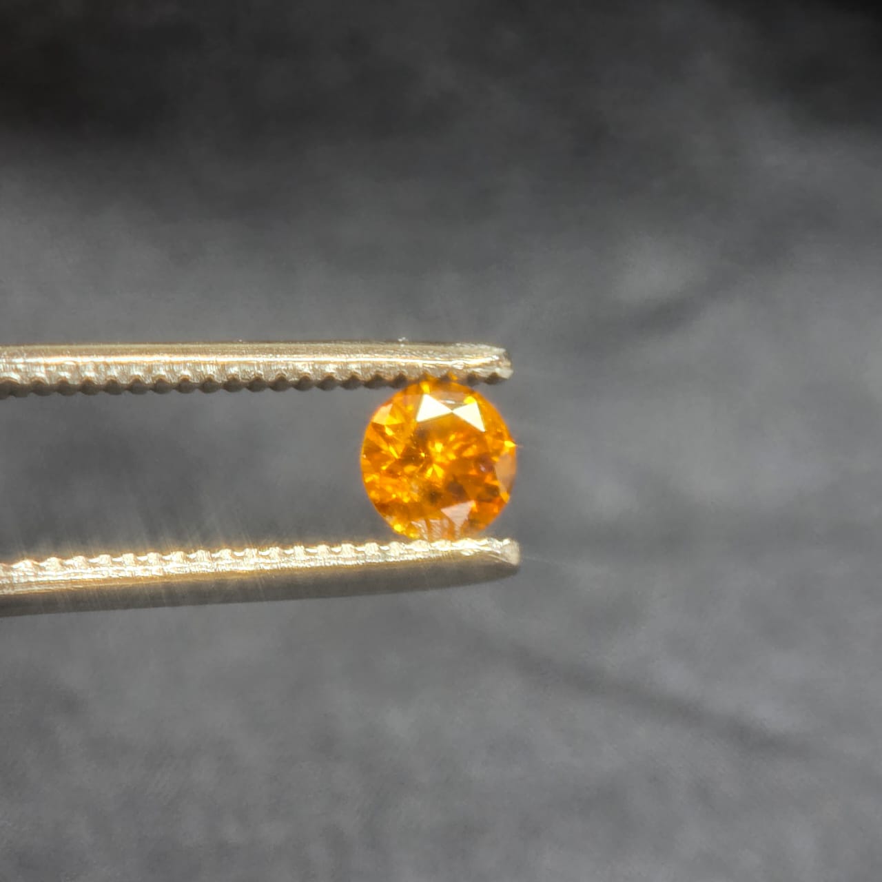 0.68 carat Fancy vivid orange yellow
