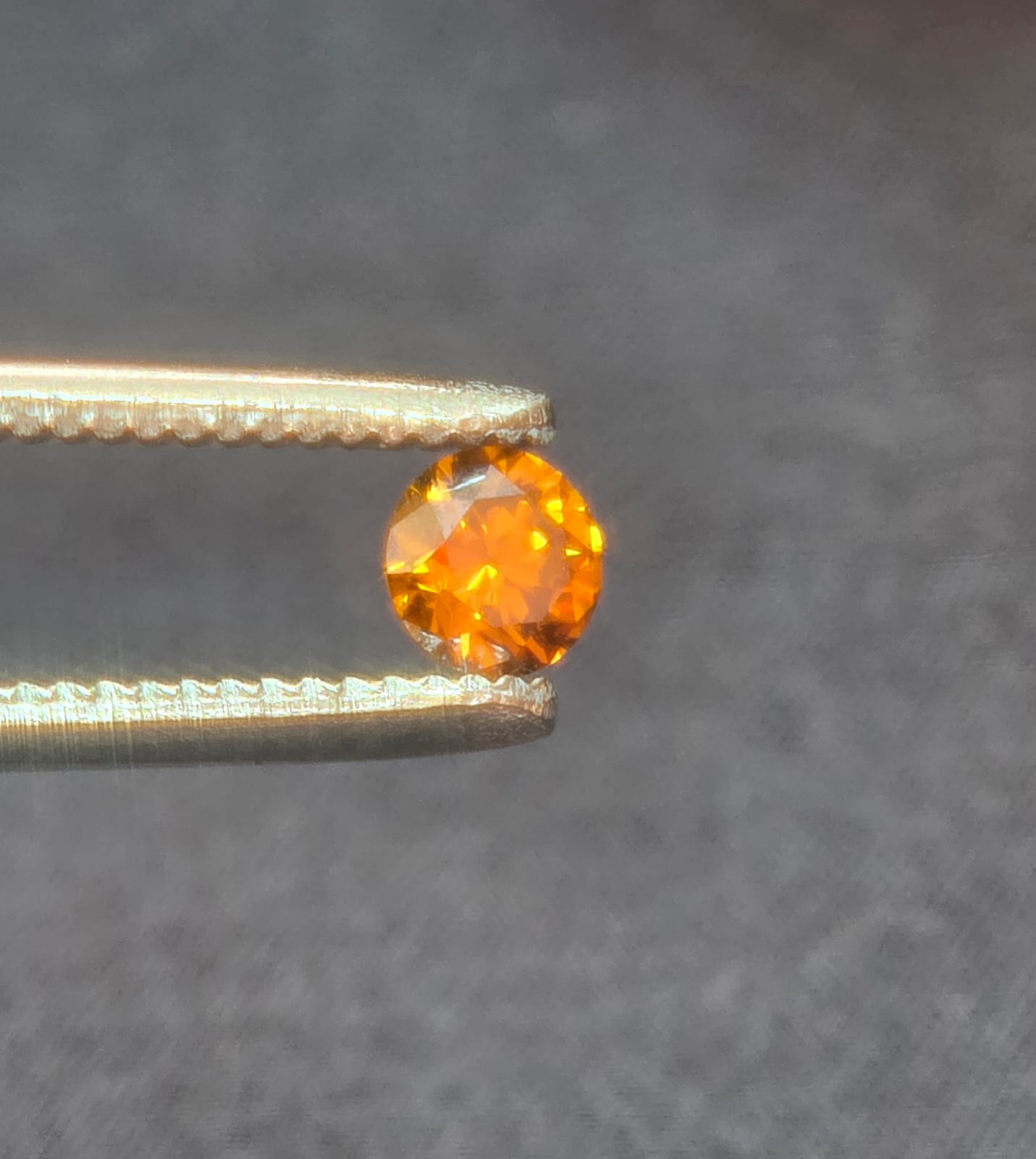 0.42 carat Fancy vivid orange brown