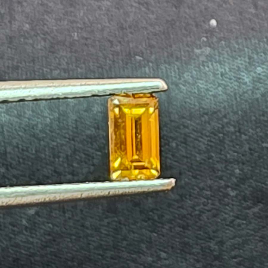 0.41 carat Long Emerald Fancy vivid brown yellow