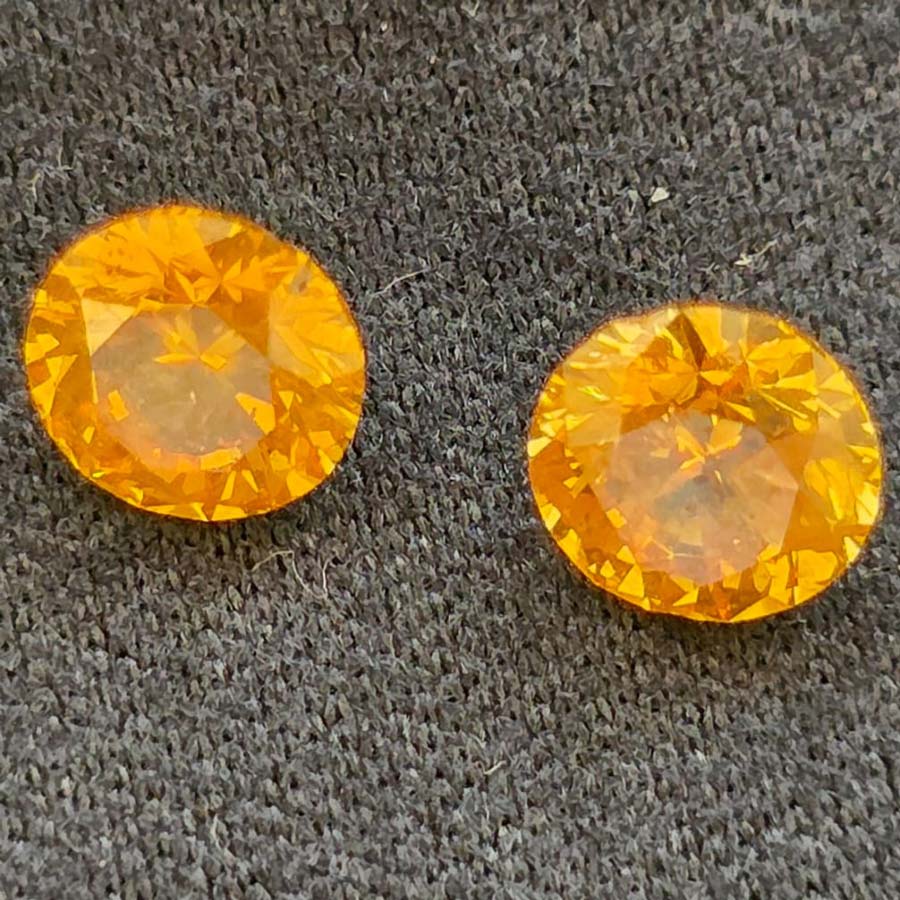 0.58 + 0.54 carat fancy vivid orange yellow